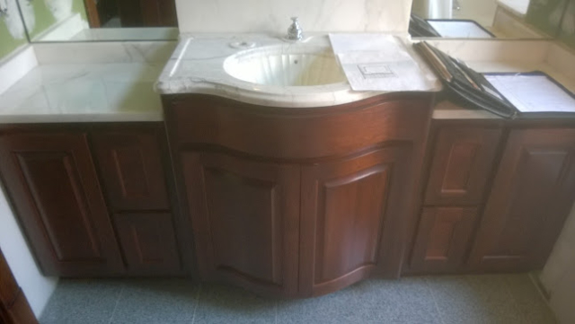 Curved cherry bathroom vanity