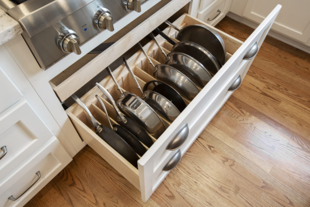 custom vertical pan and lid storage in kitchen